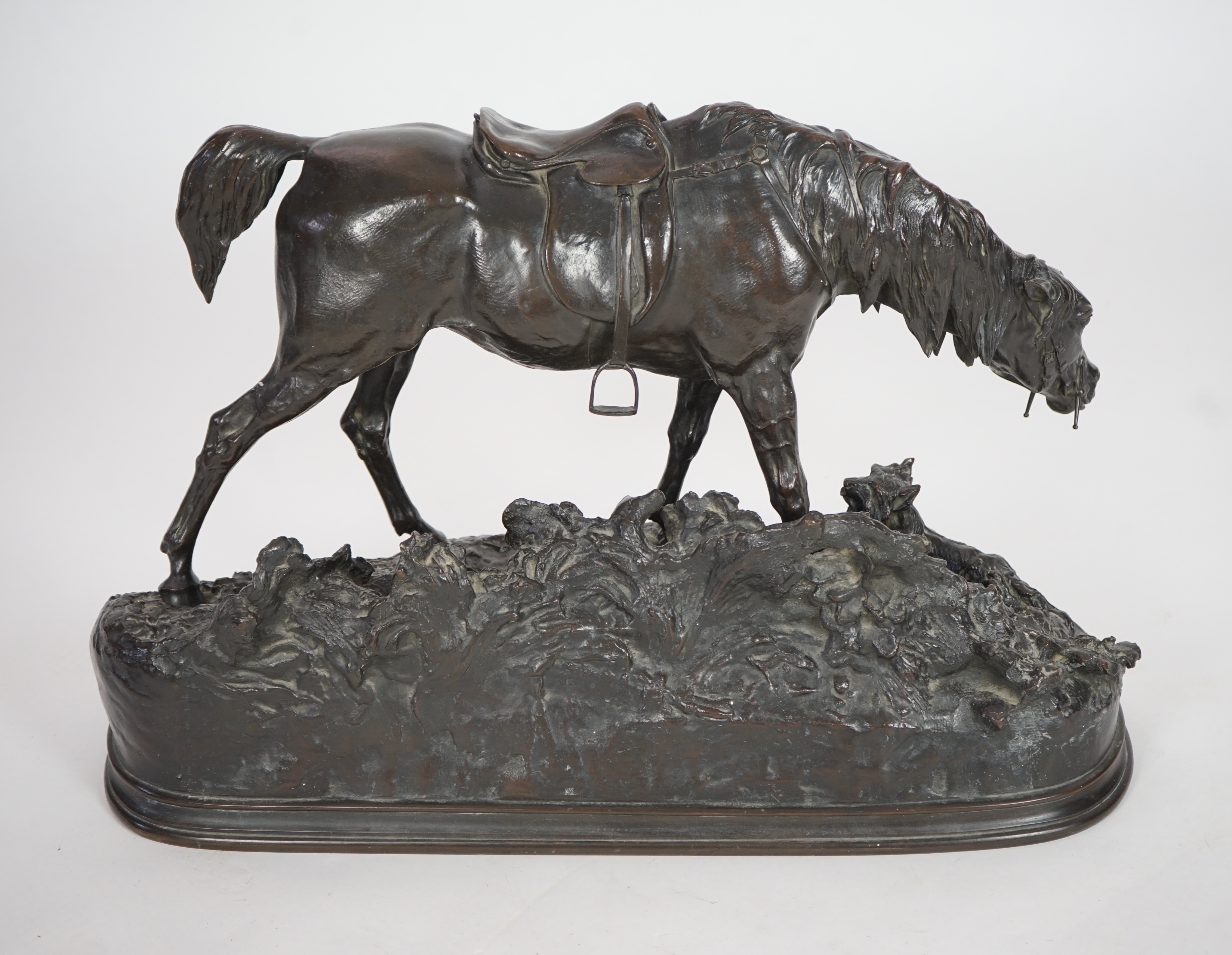 Pierre Jules Mène (French, 1810-1879). A bronze group of a saddled horse standing upon a mound with a terrier at its feet, width 69cm, height 43cm